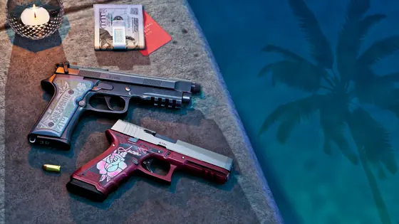 Dos pistolas con acabados personalizados sobre una mesa.